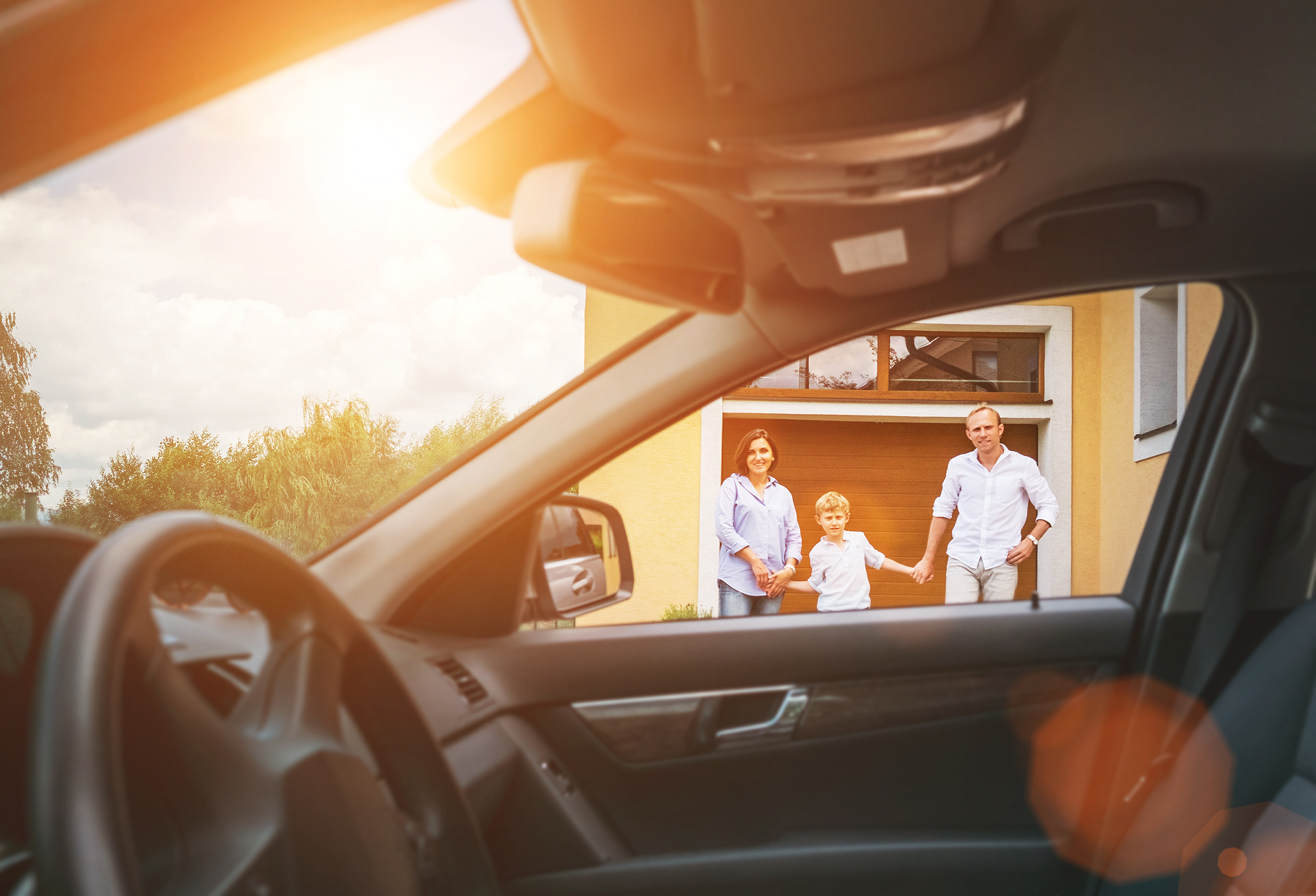 Young couple with little boy son goes to their car