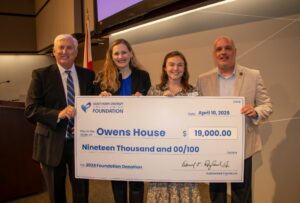 Owens House Representative accepts check for $19,000 from Southern Energy CU CEO, Derrick Ragland. 